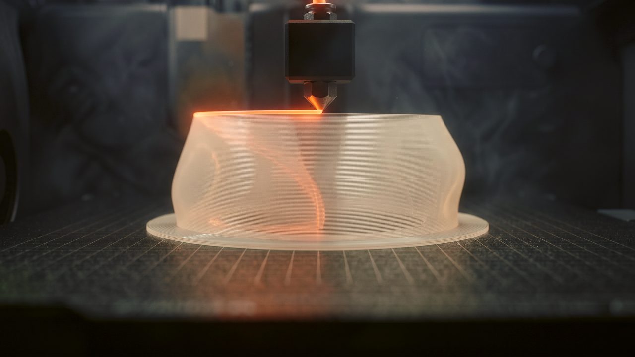 A translucent lamp shade half printed, layer by layer